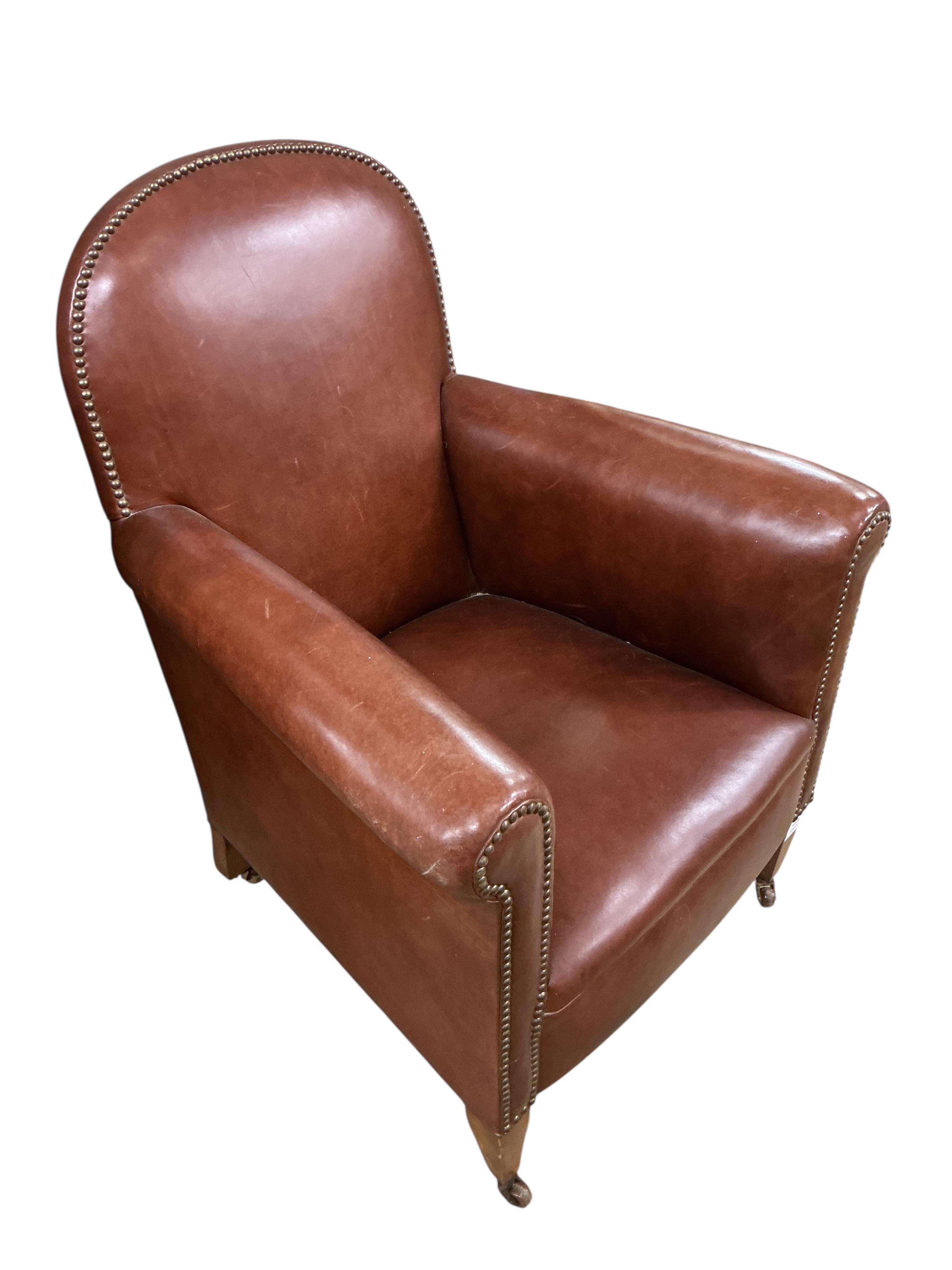 An early 20th century burgundy studded leather armchair, width 70cm, depth 65cm, height 88cm